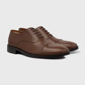 Handcrafted men's tan genuine leather cap-toe oxford dress shoes with closed lacing.